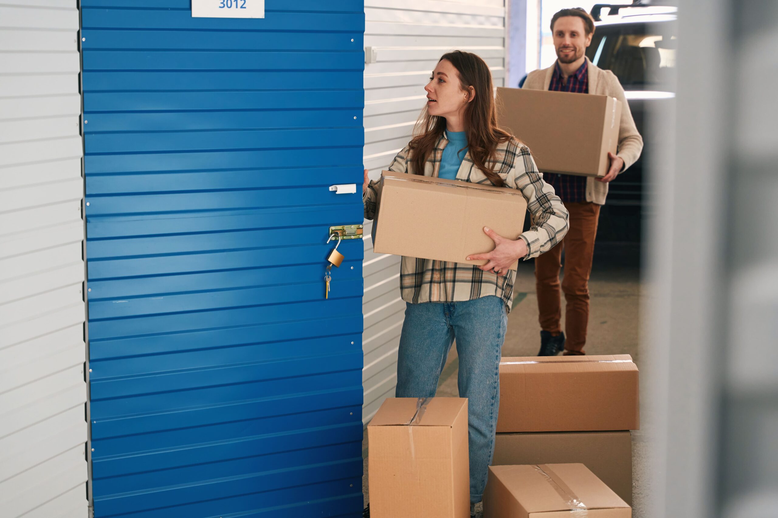 Couple entering storage locker