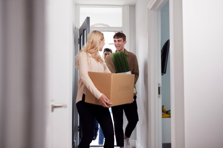 Students walking into house